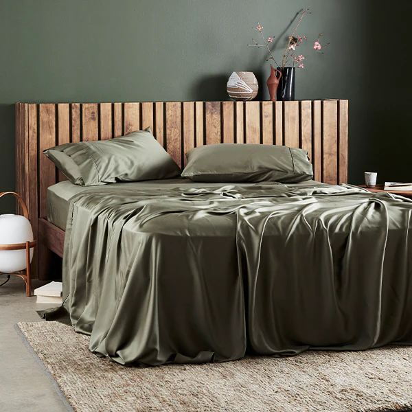 Forest Green Sheets on a silky bed.